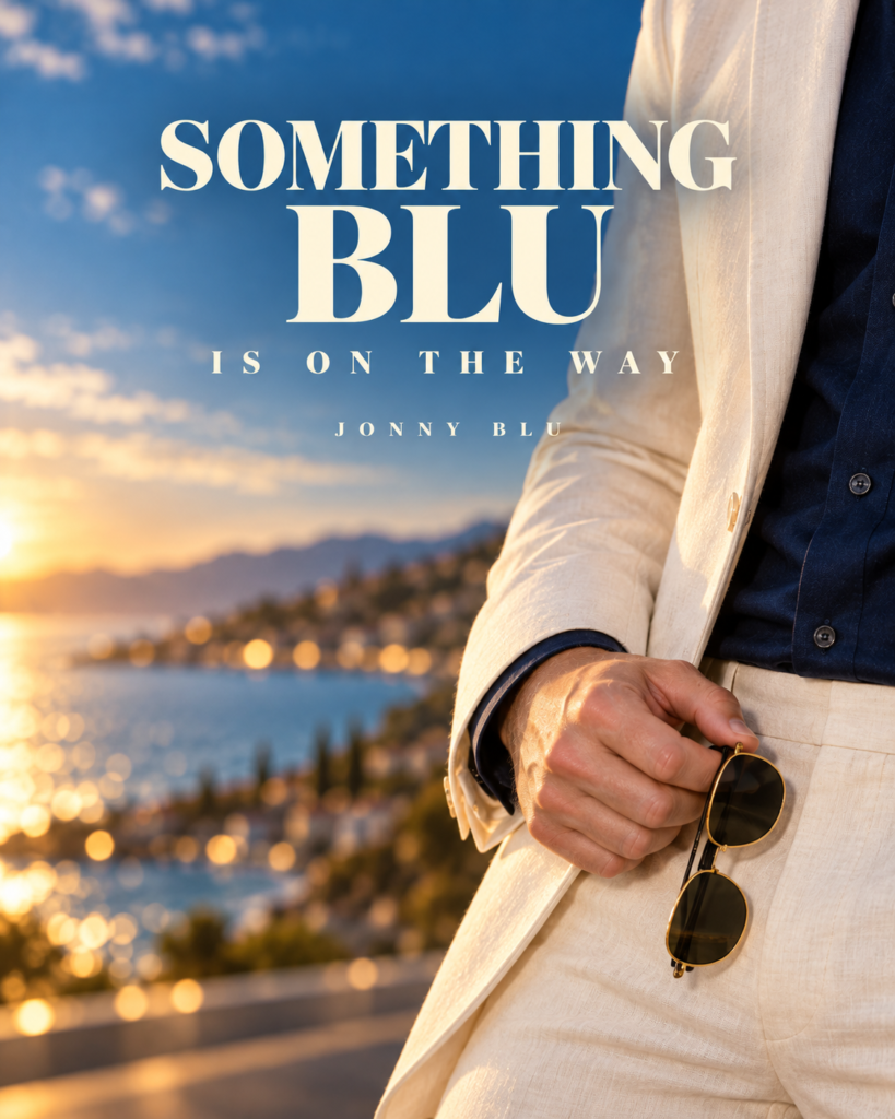 AI-generated teaser artwork showing an ivory suit, sunglasses and a sunlit coastline. Text reads Something Blu is on the way and Jonny Blu.